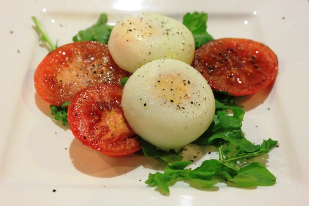 Breakfast: poached eggs with rocket and tomato